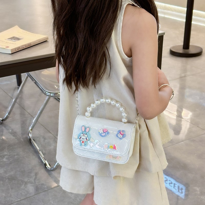 Bolso infantil 2024 nuevo estilo coreano de cadena de dibujos animados bolso de hombro estilo Xiaoxiang Ling mochila para hombres y mujeres bolsos pequeños