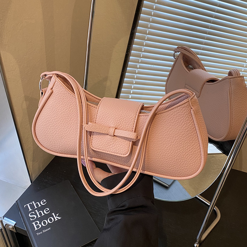 Versión coreana del bolso de axila de nicho 2025 primavera y verano nuevo bolso femenino lindo bolso de lazo bolso de hombro diario