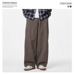 日本のファッションブランドのカードの色のレトロでゆったりしているストレートパンツの男性の春の新型は袋の広い足を貼って感じます。