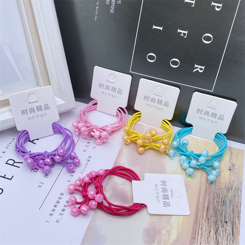 Electroplated AB color caramelo color tres en una tarjeta de dibujos animados banda de pelo banda de goma cuerda de pelo de las mujeres 2 yuanes tienda de accesorios para el cabello