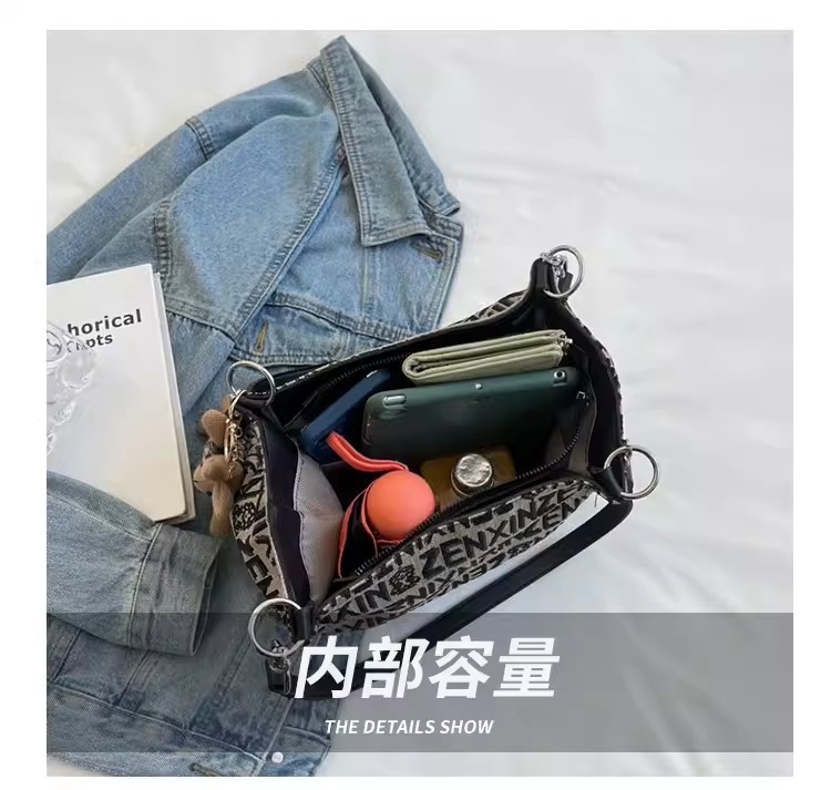 High-end quality niche bag for women 2023 new versatile single-shoulder underarm tote bag, niche hand-carry commuting fabric bag undefined