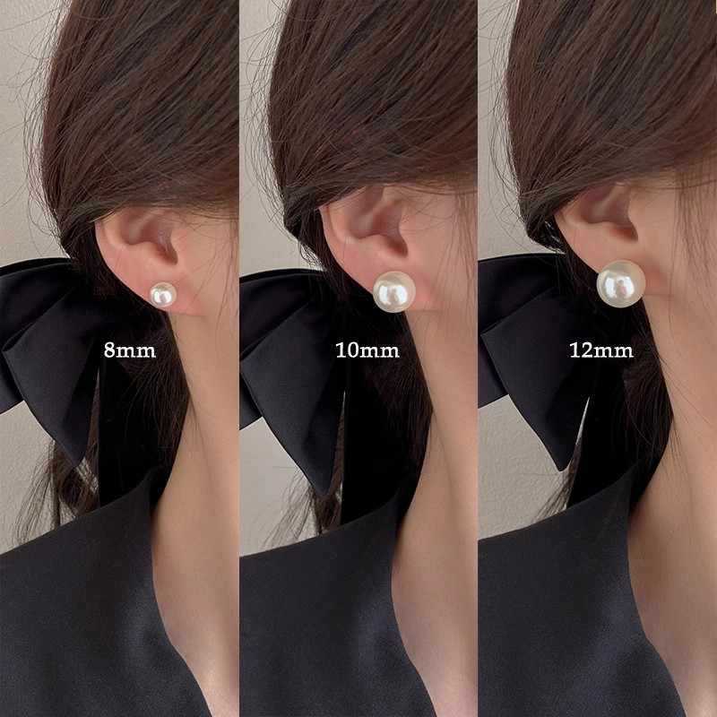 Luz de lujo de alto nivel nicho de diseño femenino sensación de aretes de bordilla temperamento perla asimetría joyería perla al por mayor