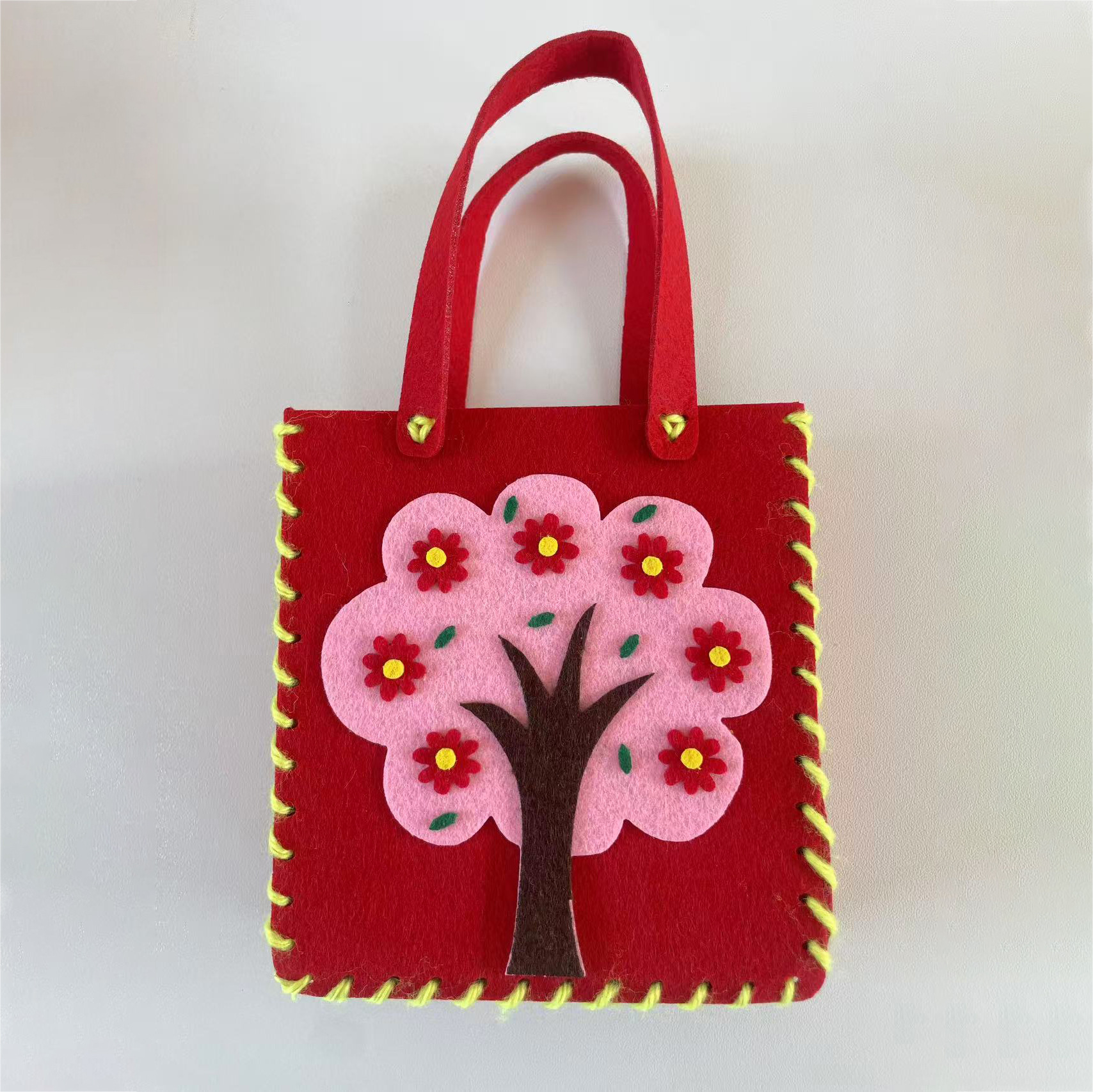 Jardín de infantes bolsas hechas a mano DIY bolsas de tela no tejida material de hacer juguetes creativos para niñas al por mayor