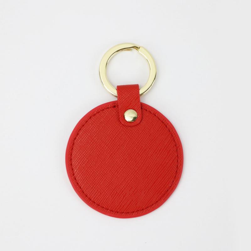 Llavero redondo de cuero genuino personalizado creativo simple colgante hombres y mujeres pequeño exquisito pequeño regalo al por mayor todo a juego