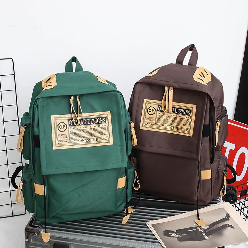 Korean version of female middle school students backpack wholesale backpack male plus LOGO large capacity travel bag business computer backpack