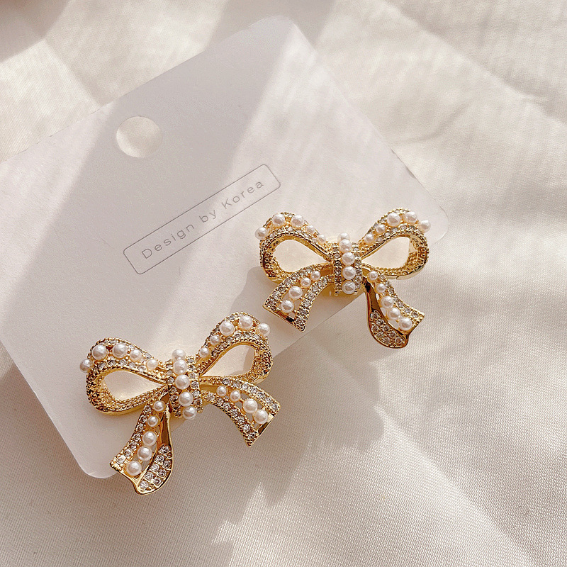 Micro-inlaid Pearl Bow Earrings display picture 3
