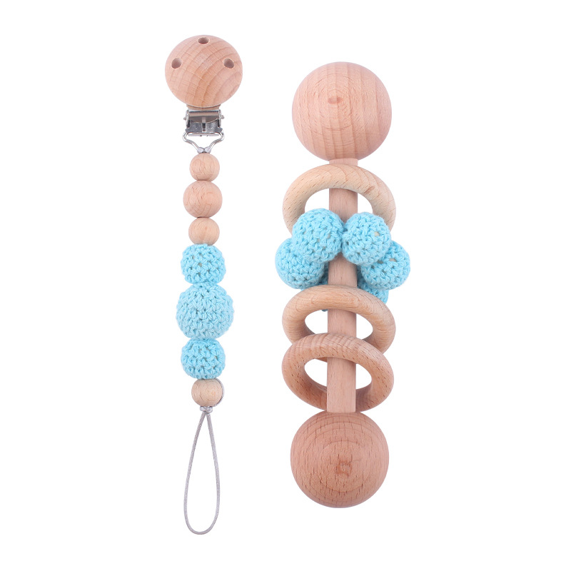 Nuevo bebé suministros Beech Rattle teether juguete calmante bebé bola de lana cuentas de madera pezón cadena traje