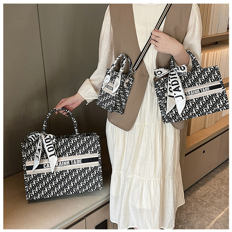 Bolsa de mano tipo satchel al por mayor de Baigou para mujer 2025 nueva moda europea y americana con letras impresas de gran capacidad.