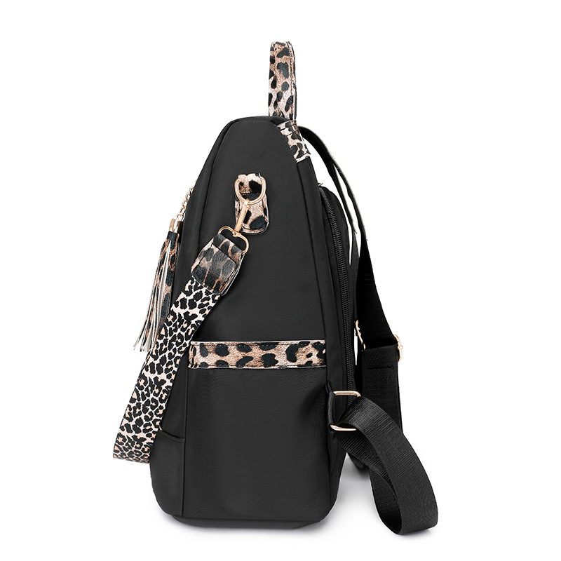 Comercio exterior al por mayor 2025 nuevo estilo antirrobo señoras mochila moda leopardo borla viaje al aire libre mochila de doble uso marea