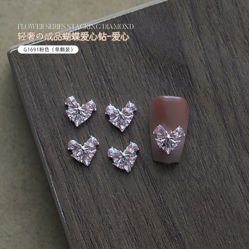 Love bowknot aleación manicura pila de diamantes productos terminados celebridades de Internet nuevas decoraciones de uñas de diamantes de pila súper flash al por mayor