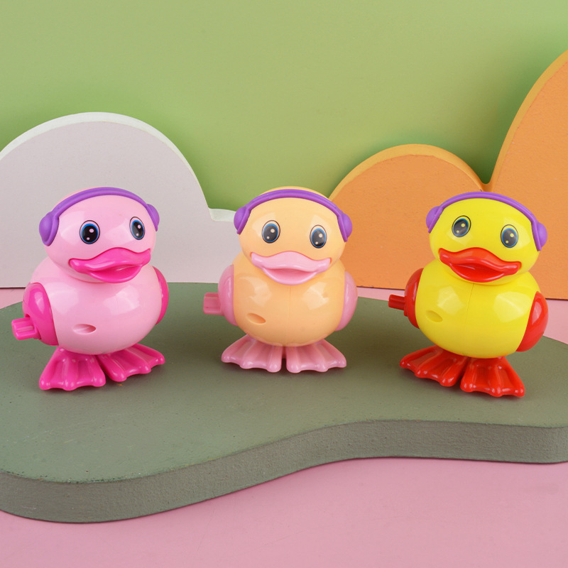 Bobinado pequeño pato reloj pequeño pato puesto buena oferta precio al por mayor pato saltando juguetes para niños al por mayor