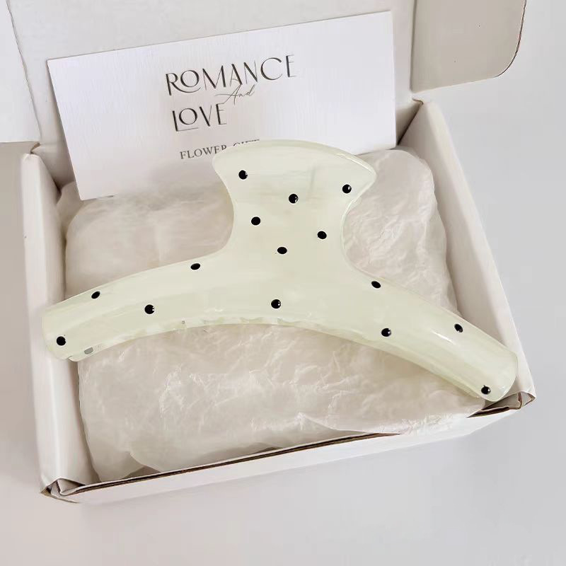 Black polka dot clothes hanger