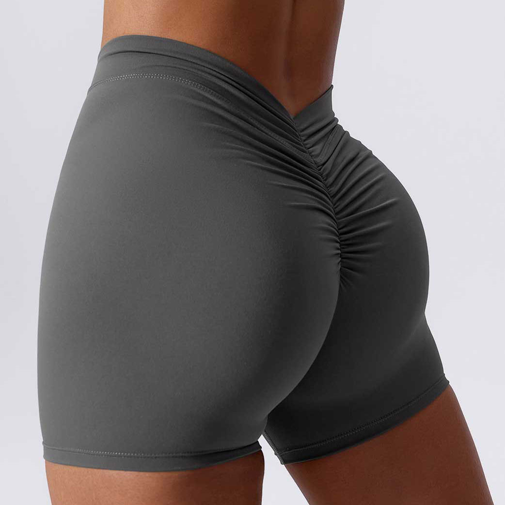 Color sólido cintura espalda V arrugas cadera elevación desnuda pantalones de tres puntos pantalones de yoga elásticos transpirables pantalones cortos de fitness de secado rápido para mujeres