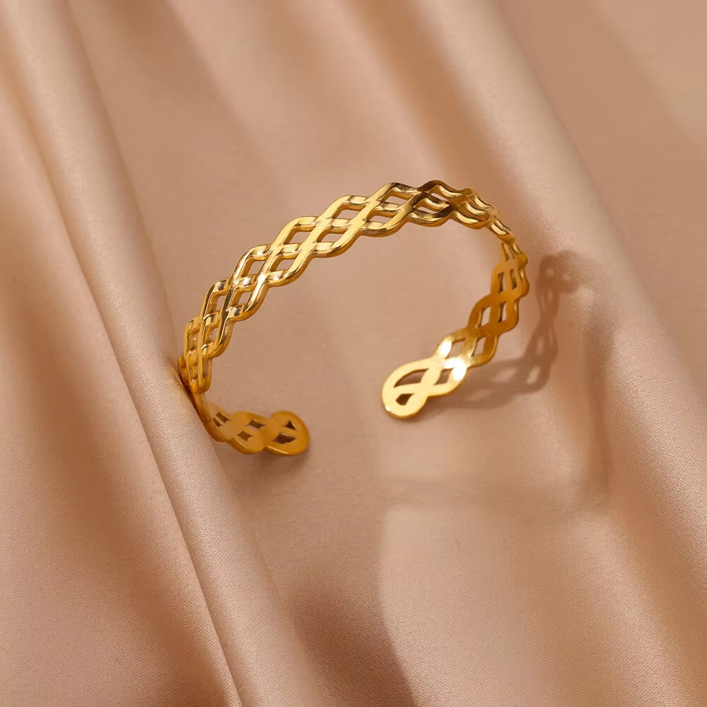 Venta directa de fábrica venta caliente de moda transfronteriza flor de acero inoxidable pulsera abierta flor hueca exagerada hoja joyería