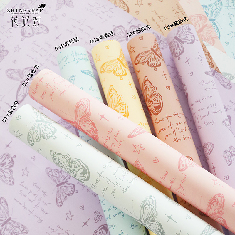 Fabricante de fiestas de flores al por mayor nuevo producto estampado de mariposas papel de embalaje de flores floristería transfronteriza paquete de ramo paquete de papel papel de flores