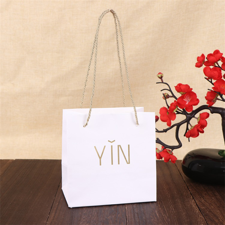 厂家供应烫金广告礼品手提袋 加厚白卡纸购物袋 服装店logo手拎袋