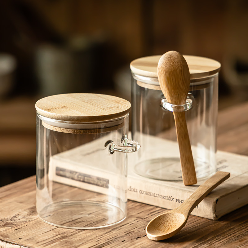 Hogar con cuchara, tanque de almacenamiento, frasco de bocadillos a prueba de humedad, tanque de té, tanque de almacenamiento de cocina transparente con tapa al por mayor
