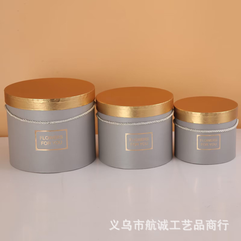 Bouquet de flores abraza barril de oro cubierta de oro estampado mano caja de regalo flor inmortalidad caja de embalaje de flores en stock