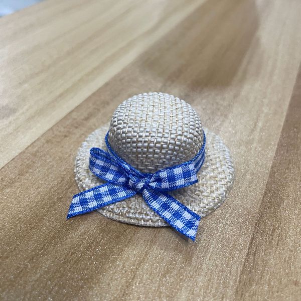 small woven plush toy with bow