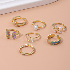 Elegant European and American Instagram-style oil-drop butterfly ring for women&mdash;featuring a unique design, pearls, geometric details, and an adjustable opening. Perfect as a trendy, must-have ring!