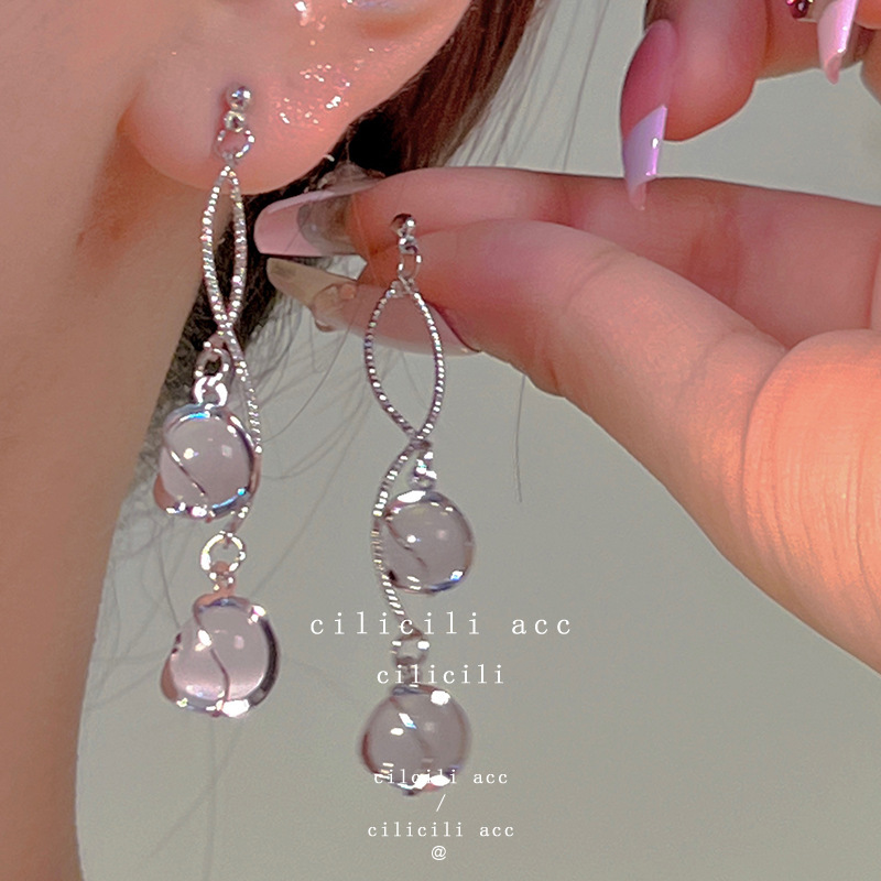 Diseño de nicho de alta gama borla larga sin orejas clip de oreja elegante estilo occidental de las mujeres cara-mirando pequeños nuevos pendientes de moda