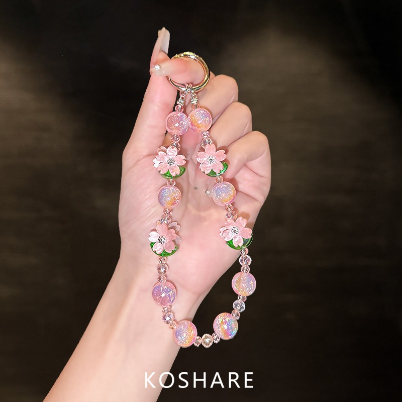 Flor de melocotón brillante cadena de teléfono móvil ligera de lujo de alto nivel colgante de cristal de moda anti-caída colgante de mano perlas para mujeres