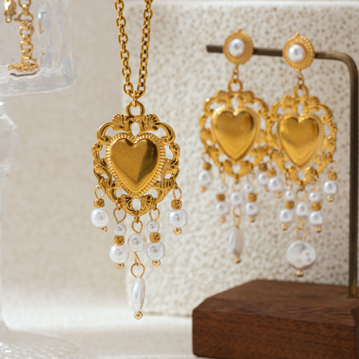 Taina estilo europeo y americano acero inoxidable perla de rosca amor collar pendientes conjunto de joyería de acero titanio para mujeres no desvanecerse transfronterizo