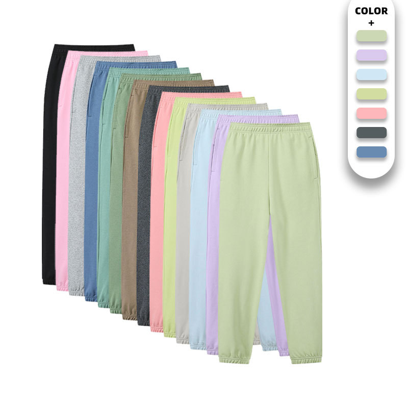 Pantalones deportivos casuales de color sólido de los hombres y las mujeres mismo peinado algodón luz tablero impreso cordón fitness correr suéter pantalones largos