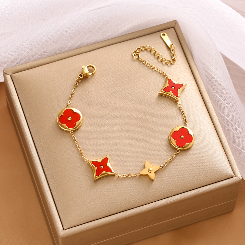 Pulsera de trébol de acero titanium vendedora caliente transfronteriza europea y americana con incrustaciones de concha pulsera colgante pulsera de diseño avanzado sin desvanecimiento al por mayor