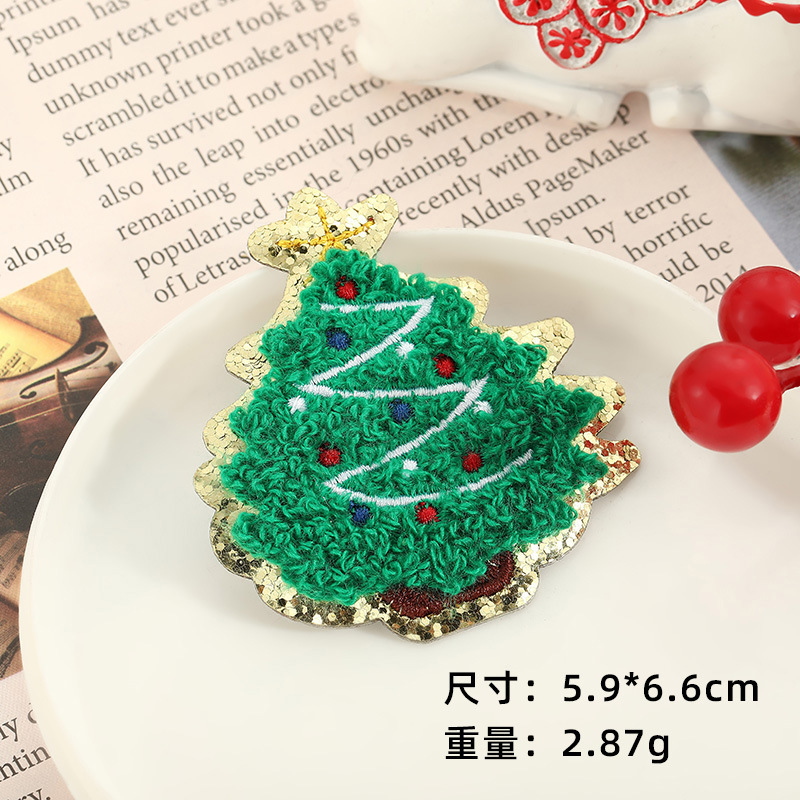 新しいクリスマスのテーマの布はサンタクロースのキャンディーの漫画を貼って服を縫うことができます。|undefined