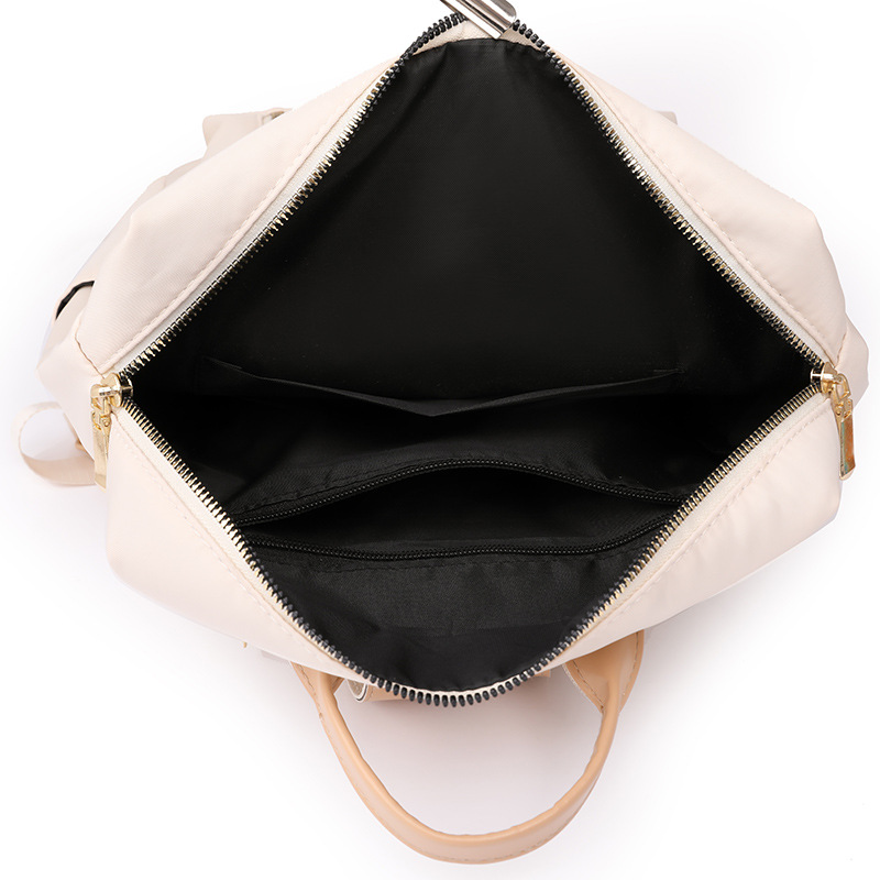 2023 nueva mochila de nailon para mujer simple moda borla literatura mochila de viaje de gran capacidad mochila escolar al por mayor