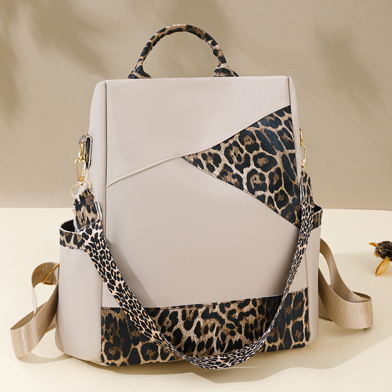 Nueva mochila con estampado de leopardo para mujer 2024 nueva mochila de viaje de todo fósforo de moda de gran capacidad mochila escolar para estudiantes de un solo hombro