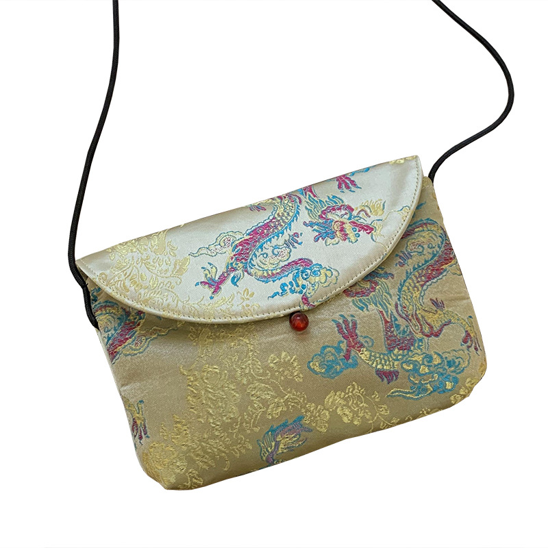 Bolso de mujer alta sensación 2025 nuevo estilo nacional bordado bolso de almacenamiento flor triturada bolsa maquillaje bolso de hombro