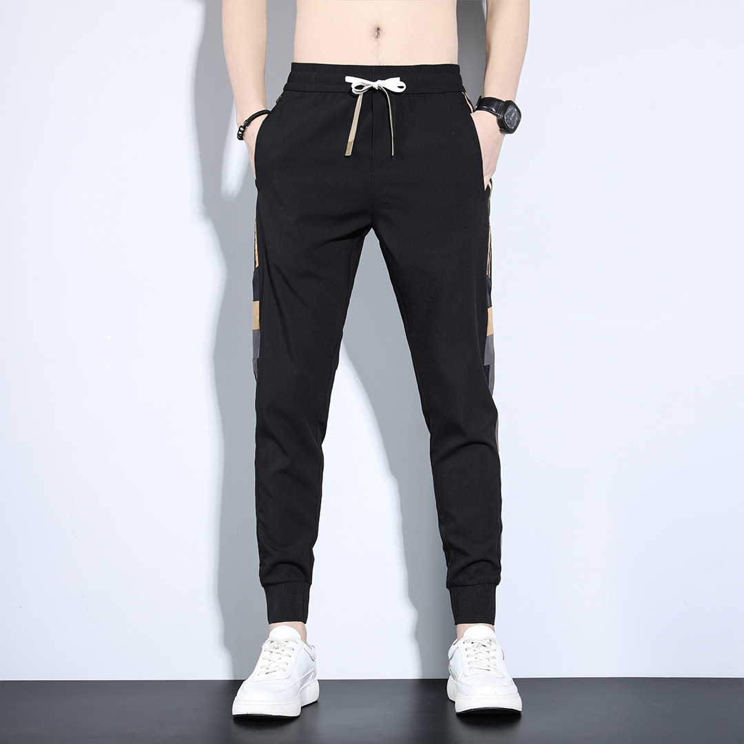 Pantalones deportivos de primavera y otoño sueltos para hombres 2023 nuevos pantalones largos casuales versátiles marca de moda de primavera pantalones harén atados al tobillo