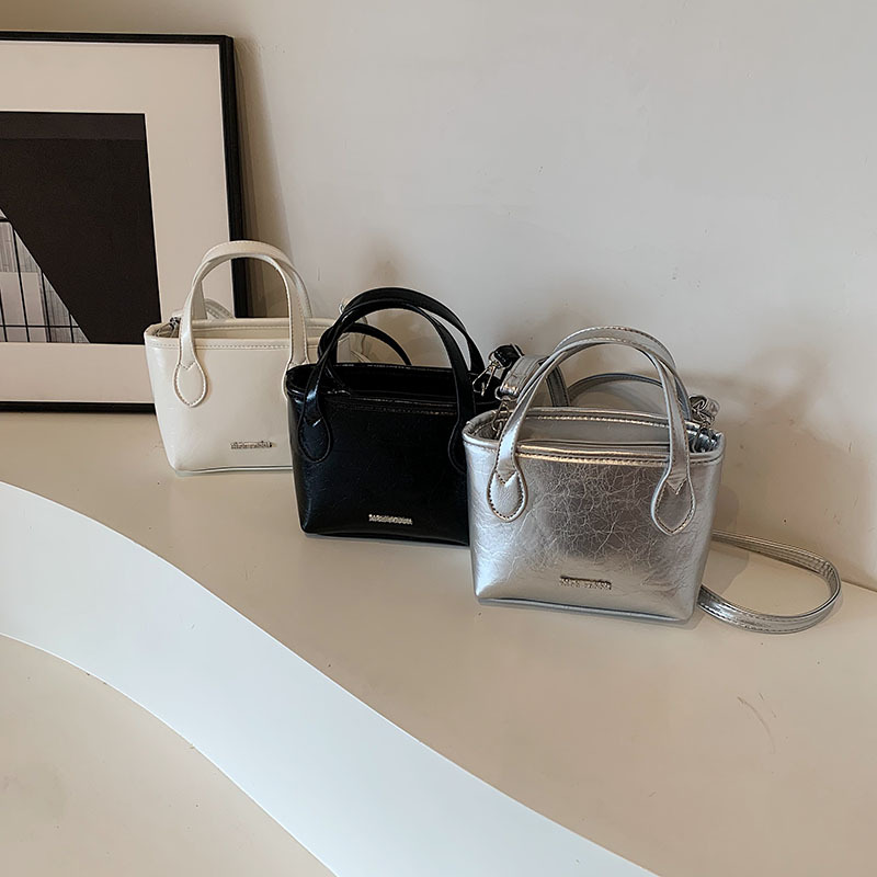 Bolso popular de este año, bolso de moda de mujer de textura alta, bolso de mochila, bolso de cubo portátil, bolso de mujer de verano