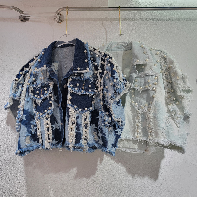 El sentido del diseño europeo y americano 2024 otoño nuevo estilo irregular bordes de polipas de clavos pesados cuentas retro caliente jeans caballo clips mujeres