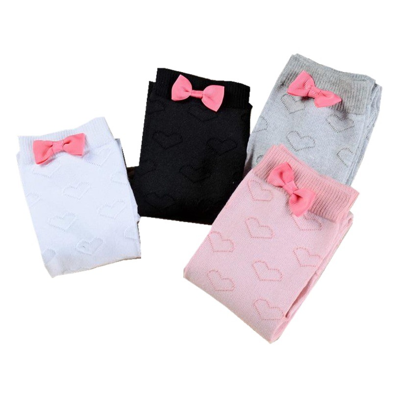 Calcetines JK holgados de tubo alto con forma de corazón por encima de la rodilla con lazo de algodón peinado nuevo estilo universitario de primavera y otoño para mujer.