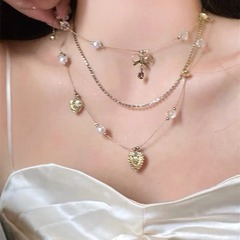 中古のヴィンテージの愛の多層はネックレスの新型のレトロな大衆の古着の鎖の女性の高級な首の鎖をかぶせます。