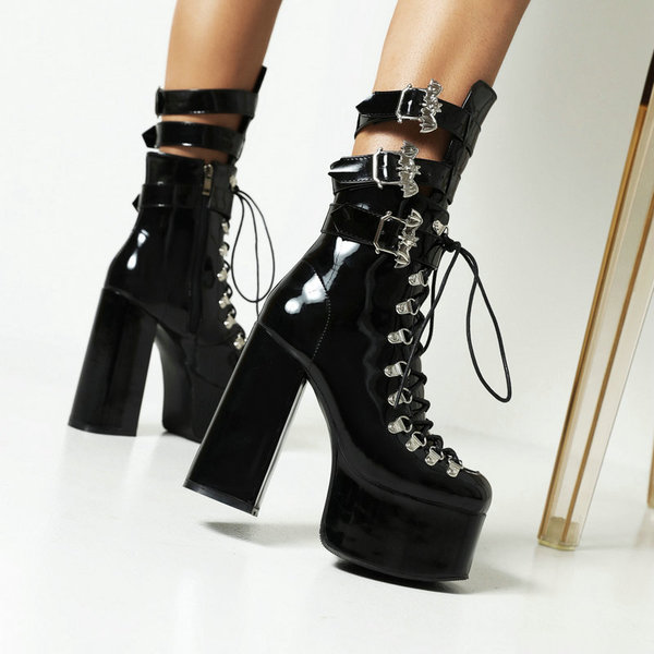 Black high boots with extremely high heels platform made of patent…
