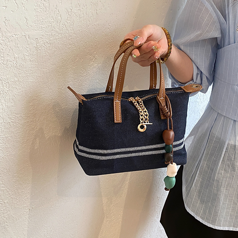 Tela estriada bolso de bolsillo de mano mujer 2026 venta caliente nuevo estilo de alta calidad sensación de moda versátil bolso de hombro
