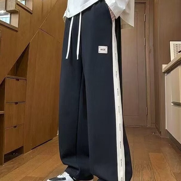 Pantalones casuales de hombre, tendencia de otoño y invierno, pantalones rectos de tamaño grande, pantalones deportivos elásticos de cintura delgada y caída.