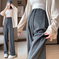 妊婦のズボンの春と秋の外は無托腹の広い足のズボンを着ています。