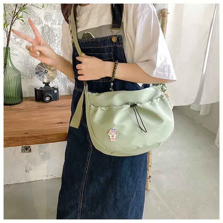 The new 2022 Little Bear canvas small bag for women is simple and versatile. The student dumpling bag is a trendy casual single-shoulder crossbody bag undefined