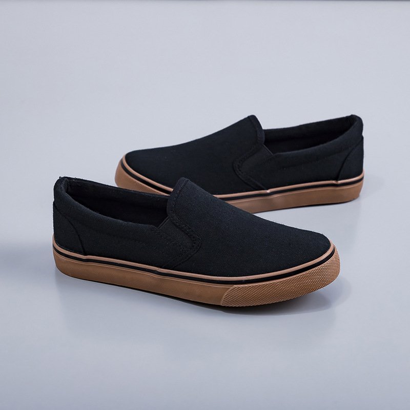 2025 zapatos de lona negros zapatos blancos perezosos un pedazo de primavera coreana para hombres y mujeres zapatos elásticos de estudiantes