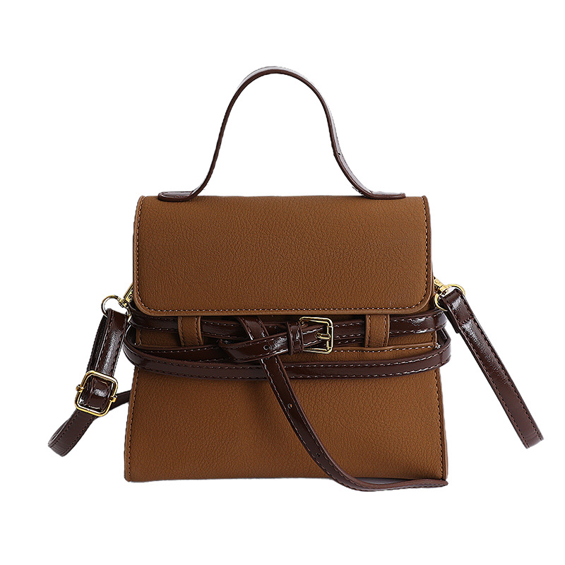 Bolsas de mano de nicho coreano de color contraste para mujeres 2026 primavera textura simple moda diaria correa de hombro mochila