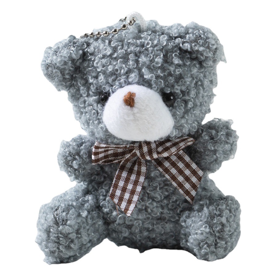 Dibujos animados lindo mini pajarita oso corto felpa muñeca juguete bolsa coche llavero colgante muñeca al por mayor