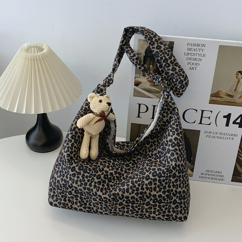 Estudiantes universitarios clase de viaje bolsa de gran capacidad para mujeres 2024 nueva moda extranjera leopardo tela mochila