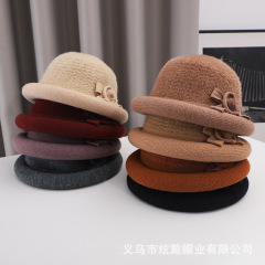秋冬の新型女性ニットは暖かくて、韓国版はファッションの毛糸の盆帽のおばあさんのモデルの蝶結びを厚くします。