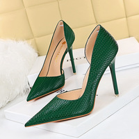1363-1 European and American sexy nightclubs thin thin heels super high heels shallow mouth pointed snake side hollow high heels single shoes