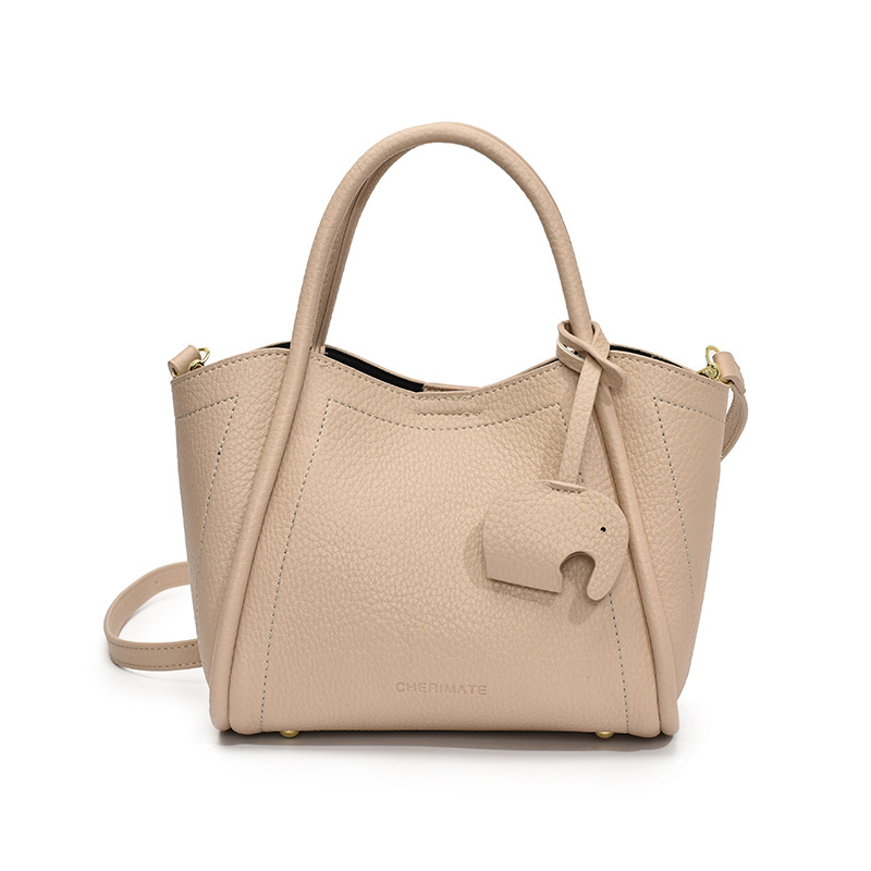 Tendencia transfronteriza de moda canasta de platos de mano 2025 nuevo nicho de alta sensación bolso de hombro bolso de cubo universal para mujeres